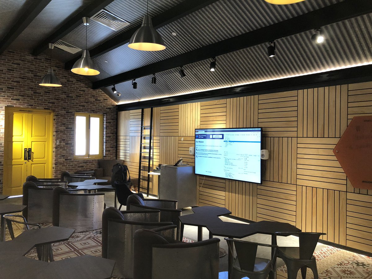 A photo of the room where the workshop was delivered. We see chairs, and a screen.