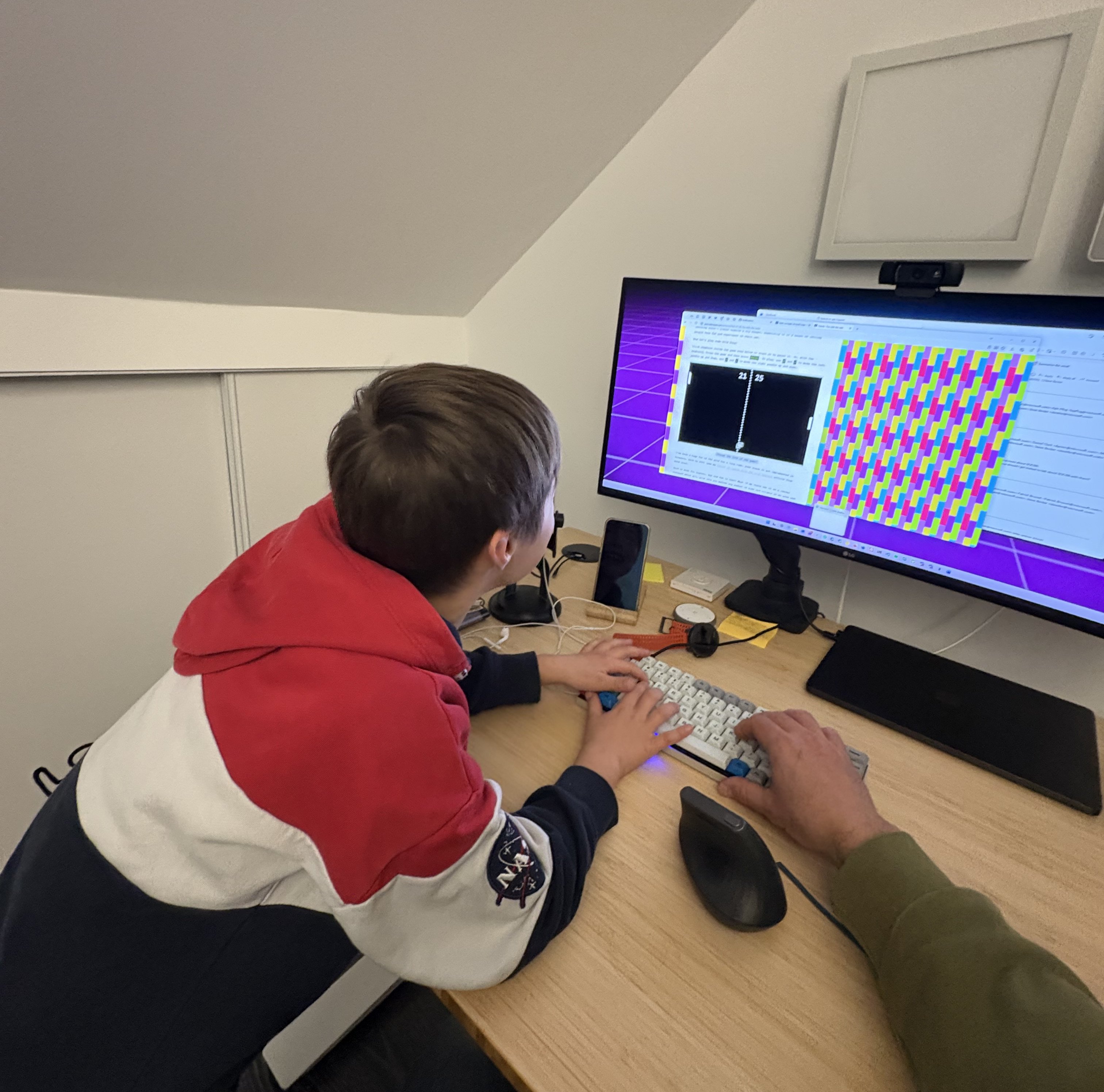 Milo and I in front of the computer, playing Pong, written in CSS